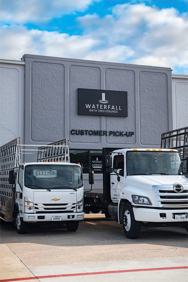 Company delivery trucks outside a branded warehouse