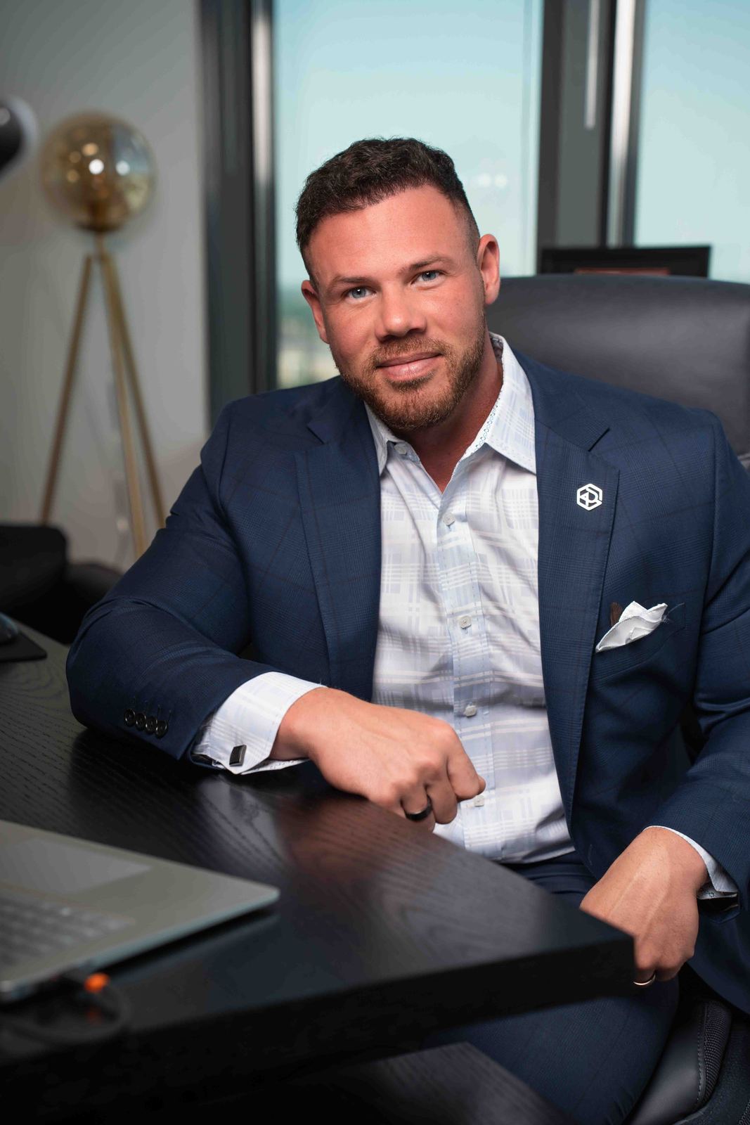 Executive seated at his desk in a modern office