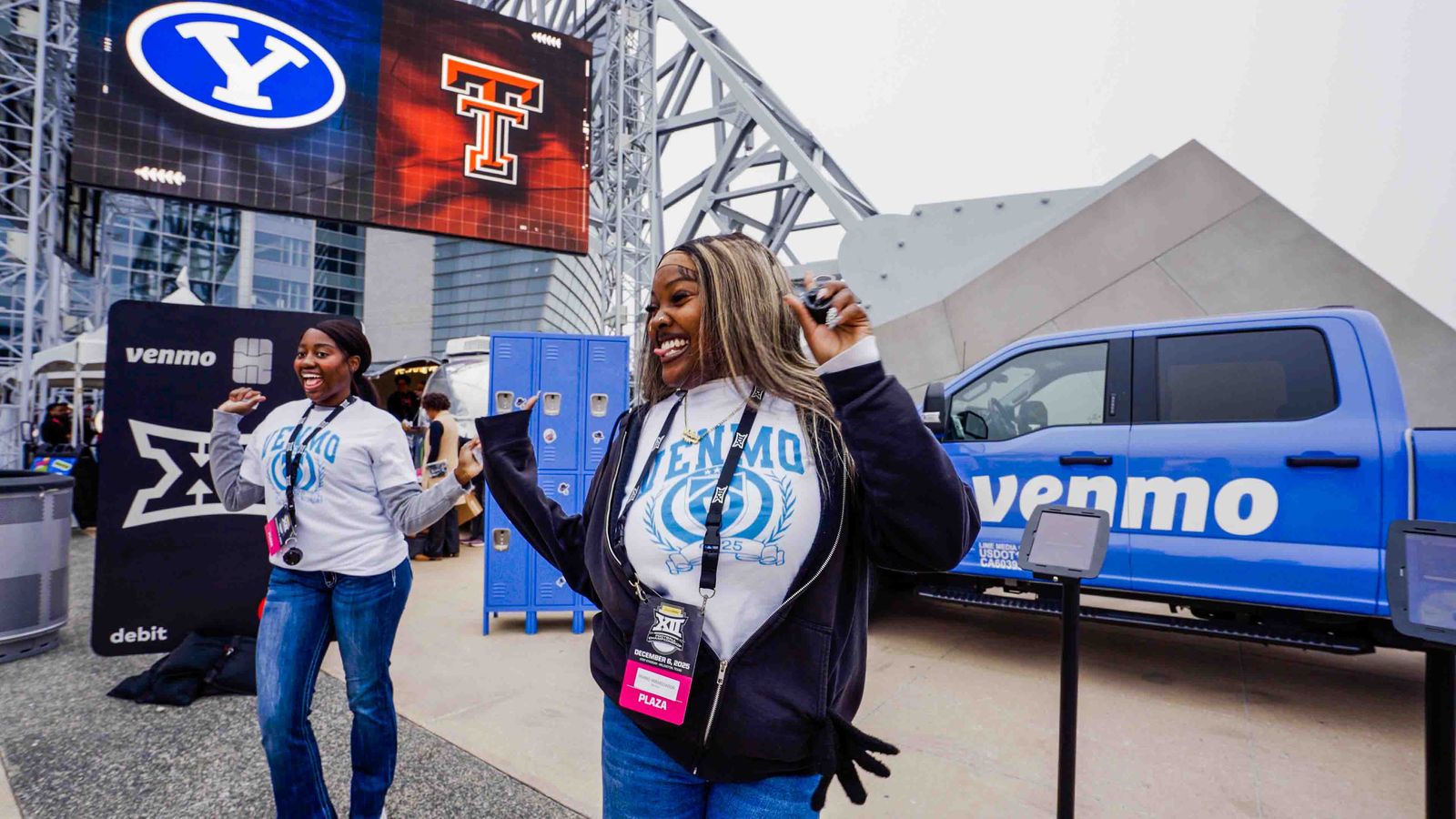 Fans celebrating at a Venmo brand activation outside AT&T Stadium