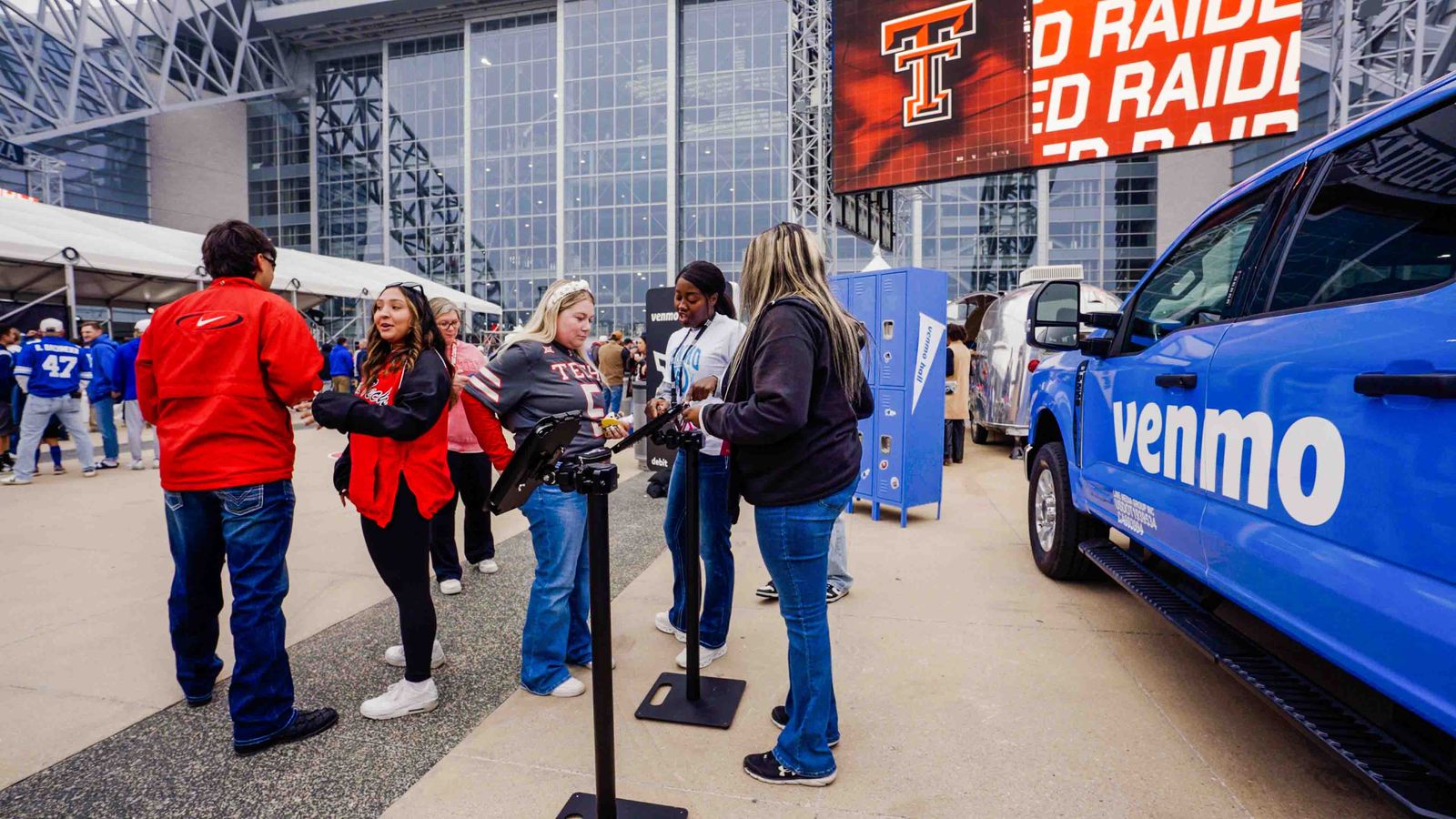 Guests lined up at a Venmo activation truck on game day