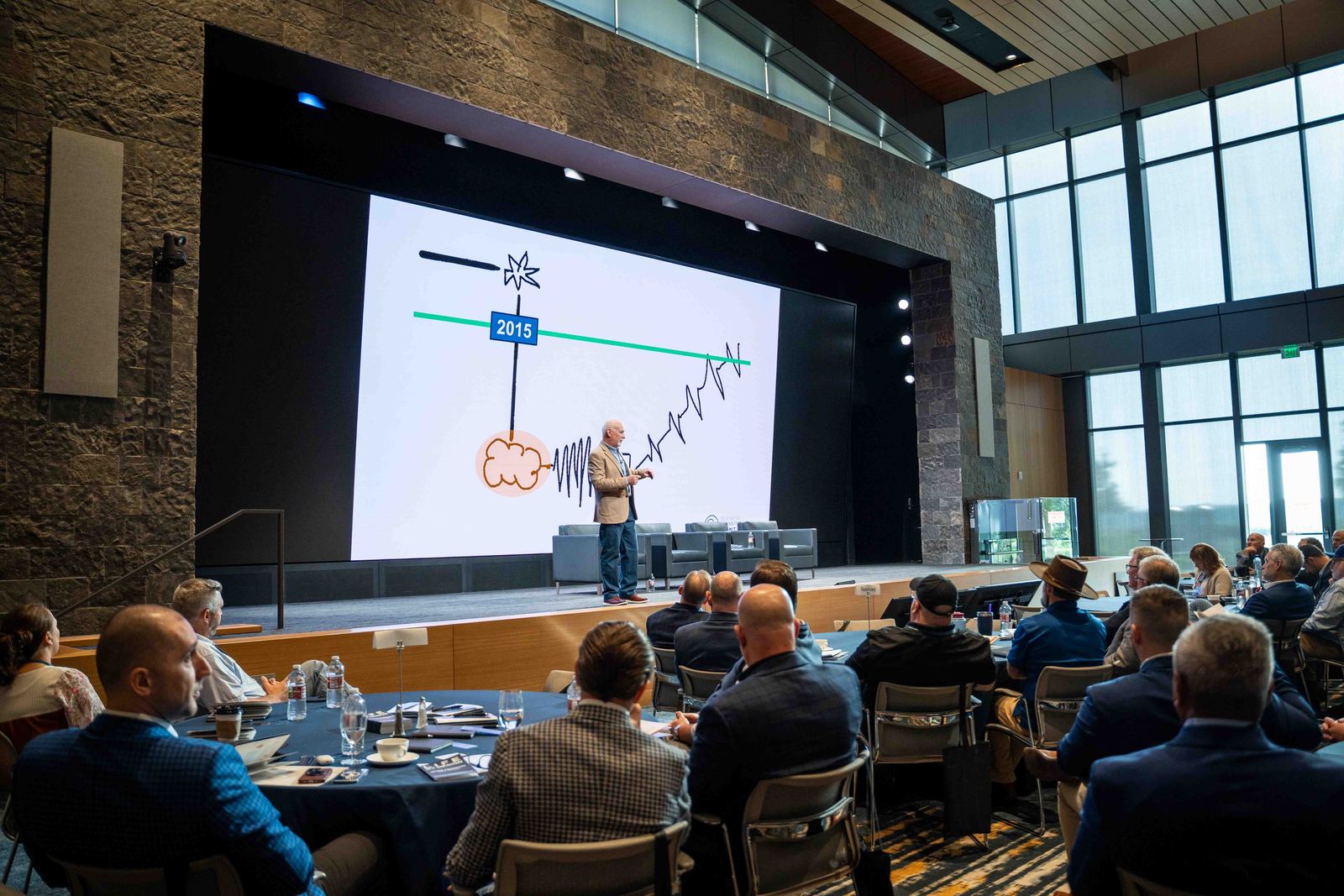 Keynote speaker presenting to a full conference room