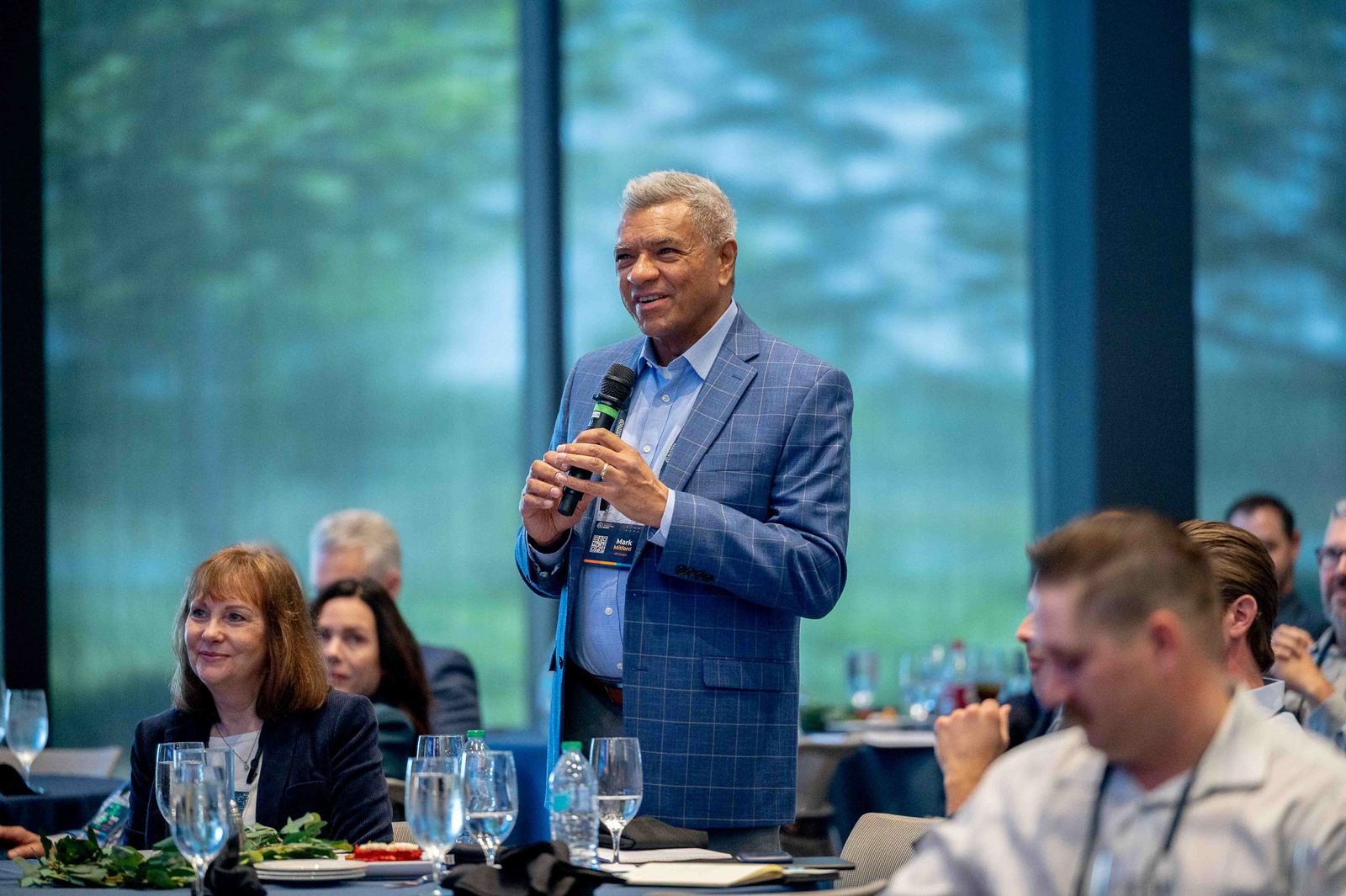 Speaker addressing a luncheon audience