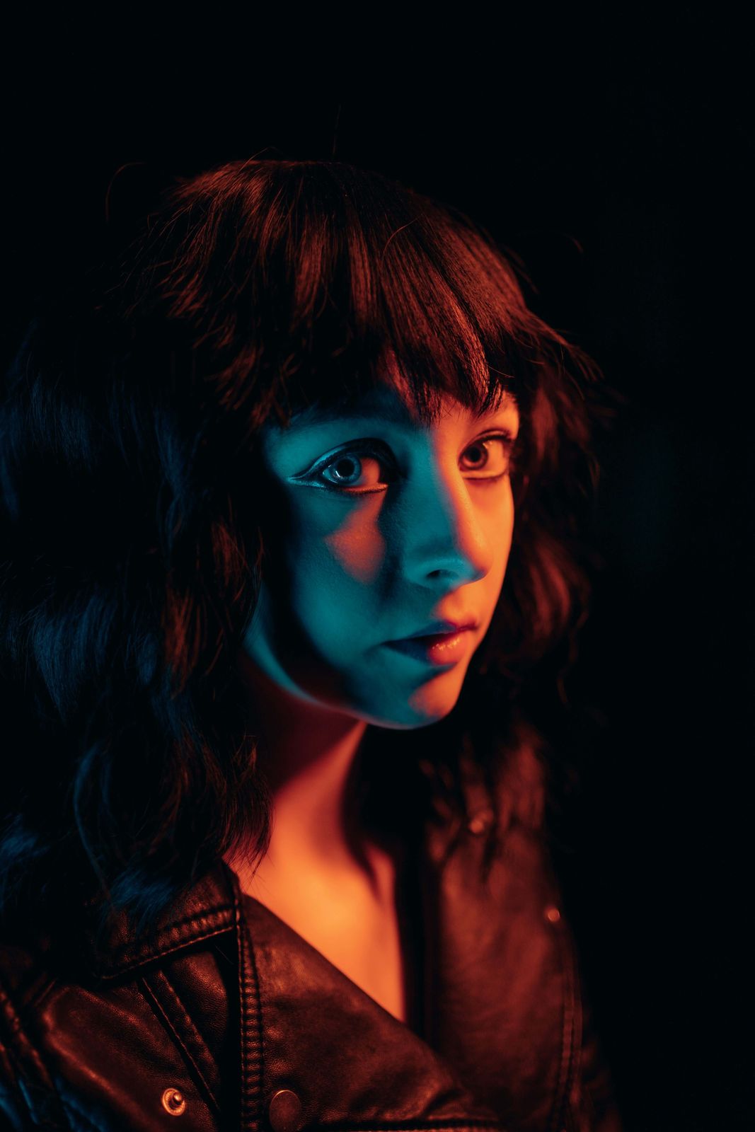 Portrait lit with blue and orange gels