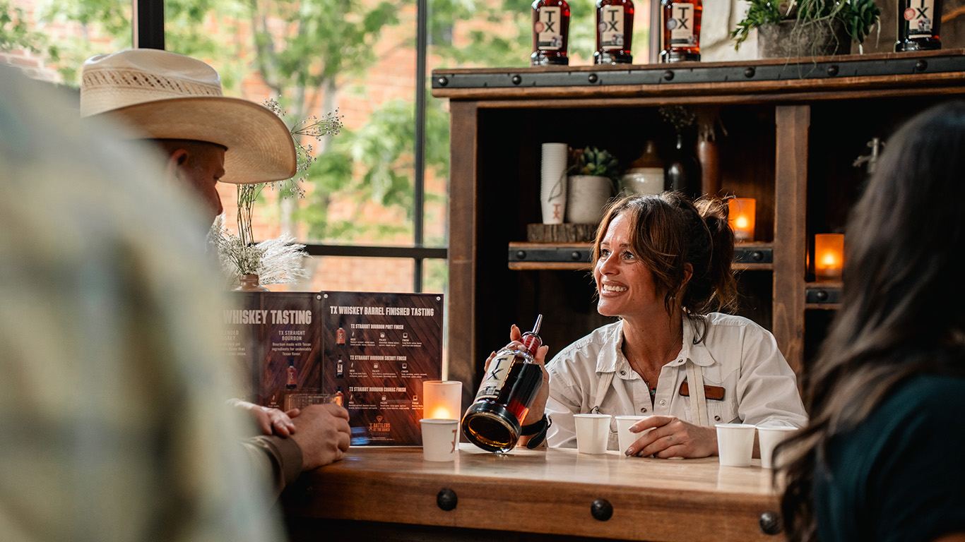 Bartender smiling during a whiskey tasting