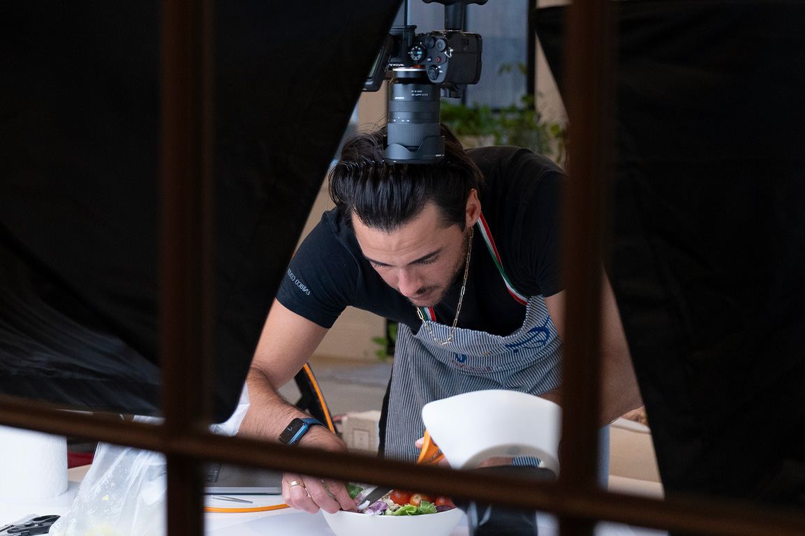 Chef plating in a restaurant kitchen