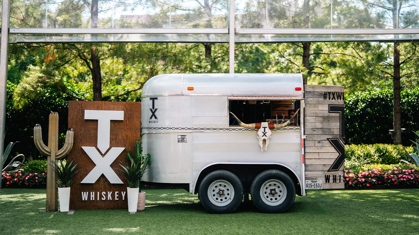 Mobile bar trailer set up on a lawn