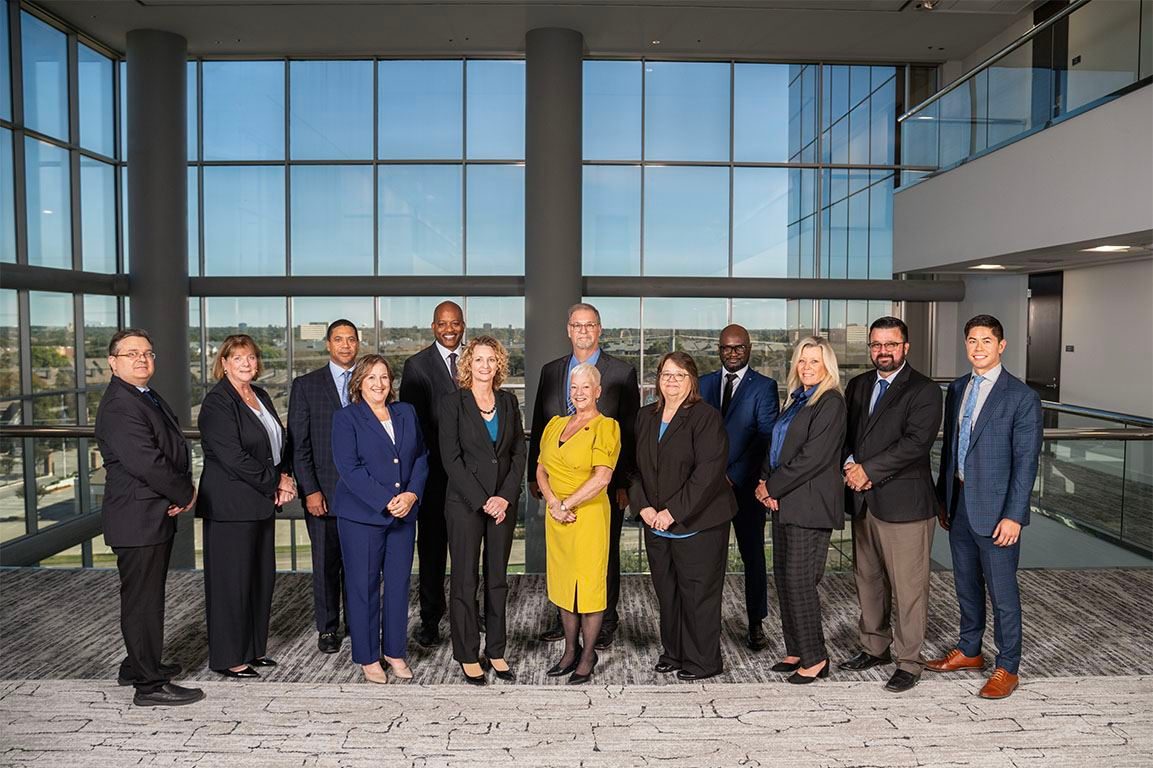 Healthcare team photo in a bright office atrium