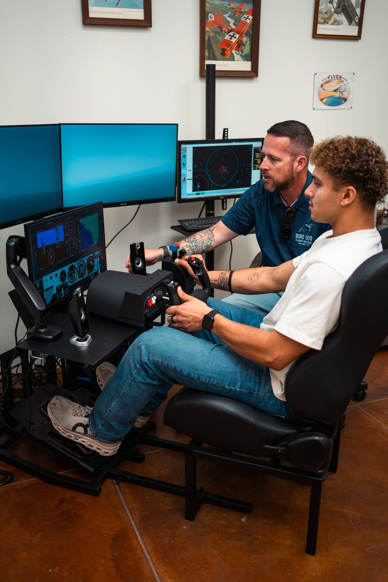 Instructor coaching a student in the flight simulator