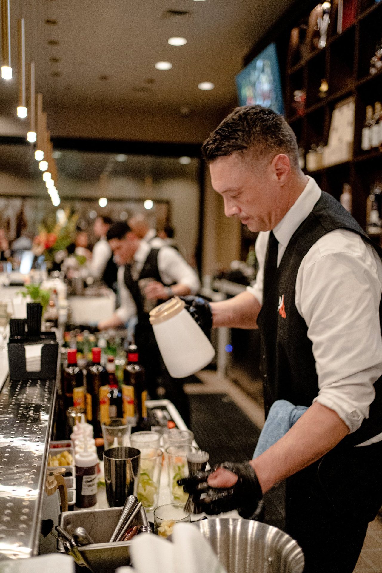 Bartender at work behind the bar