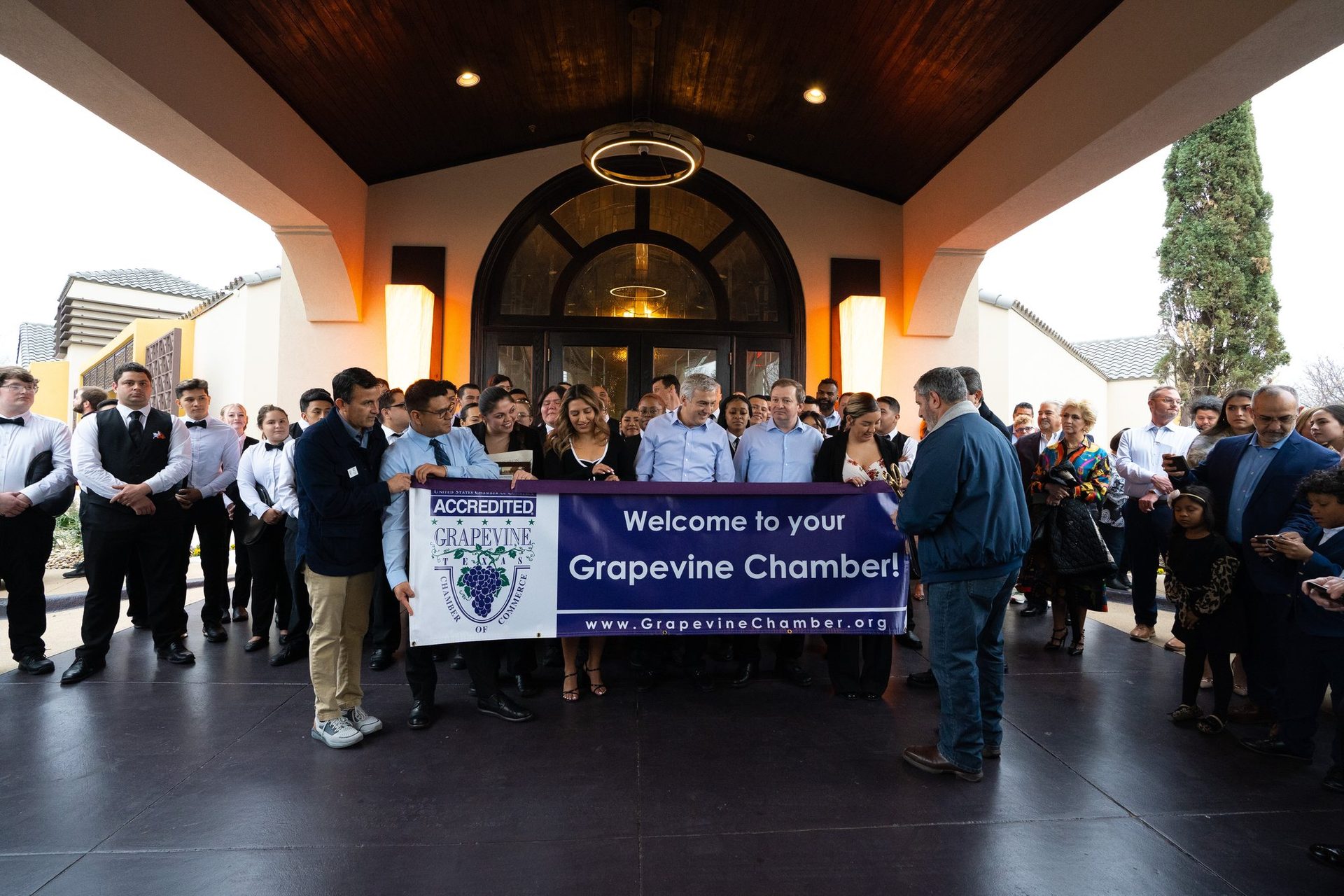 Ribbon cutting with the Grapevine Chamber at the entrance