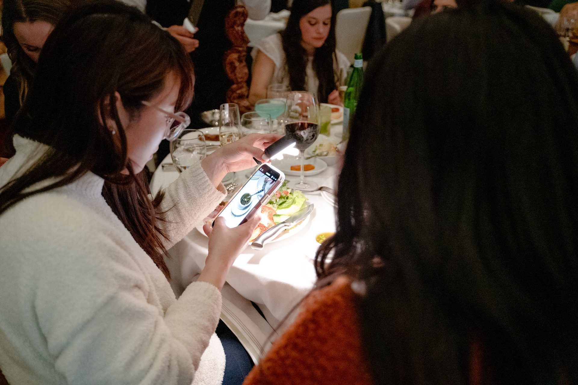 Guest photographing her plate at dinner