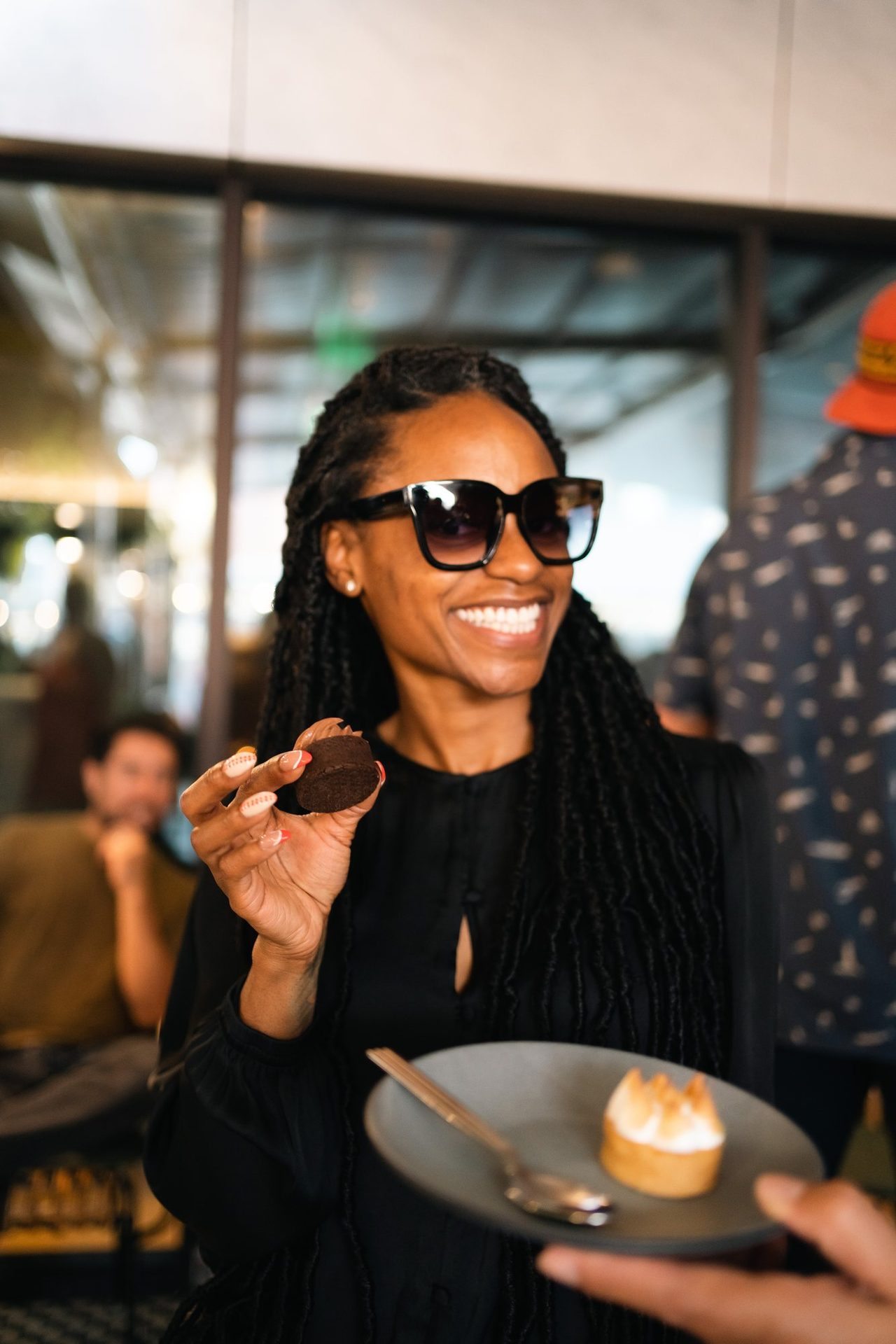 Guest smiling over a plated dessert