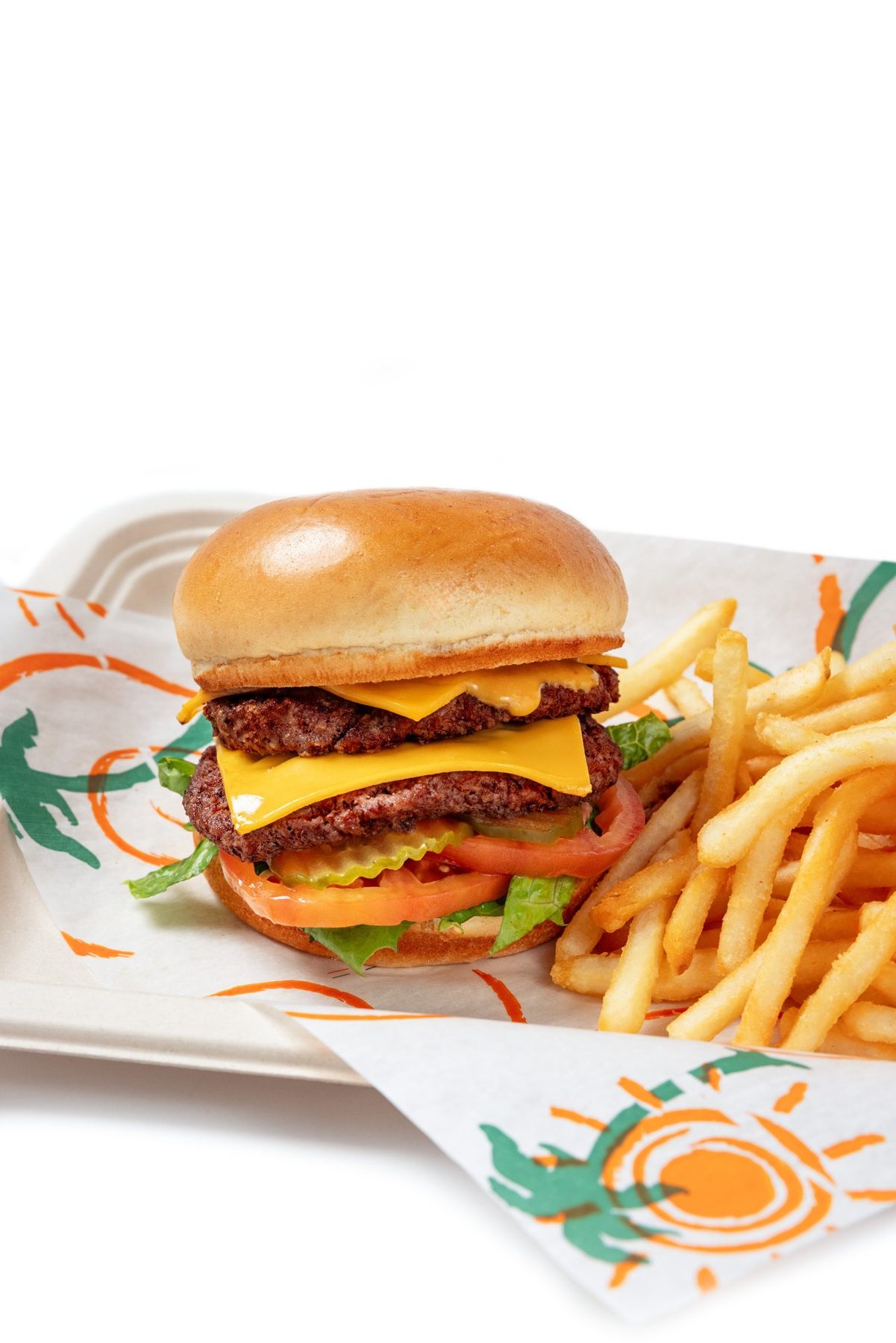 Double cheeseburger and fries on a branded tray, white background