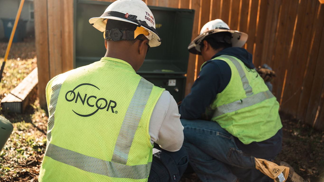 Oncor field crew working at a transformer