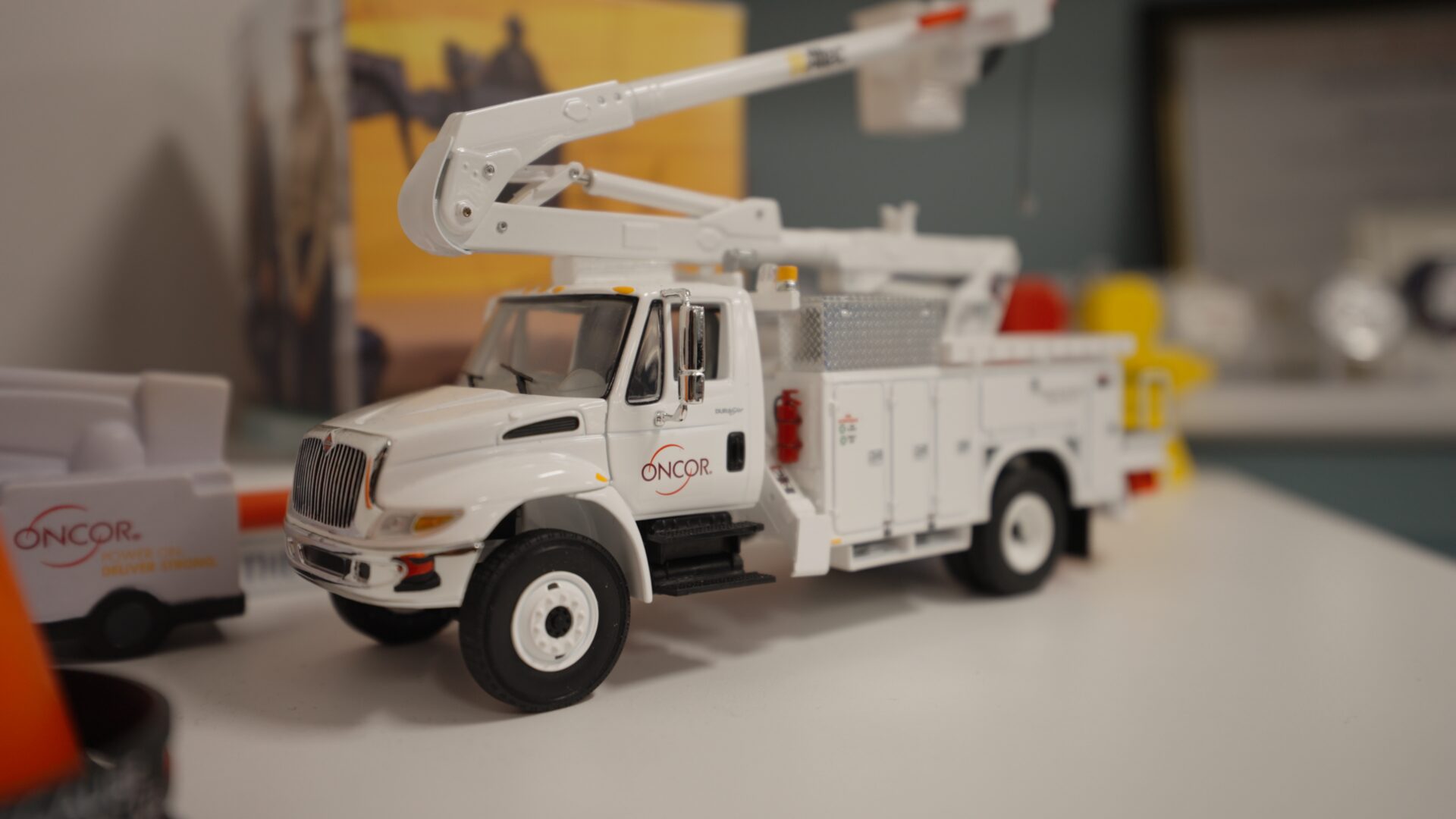 Model Oncor bucket truck on an office desk