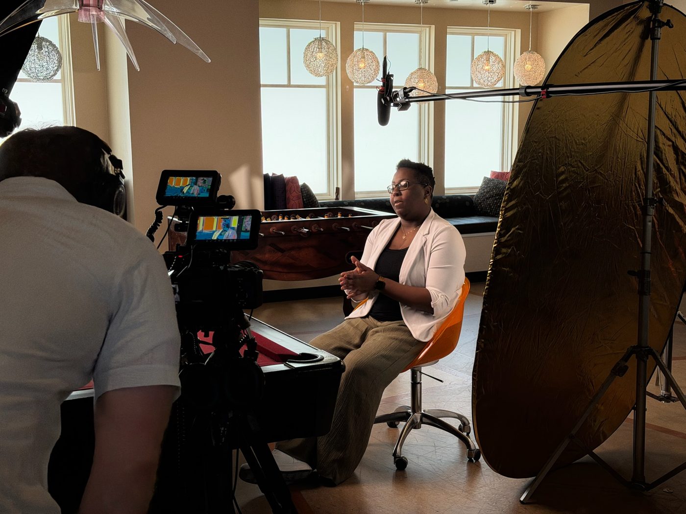 Filming an interview in the piano room