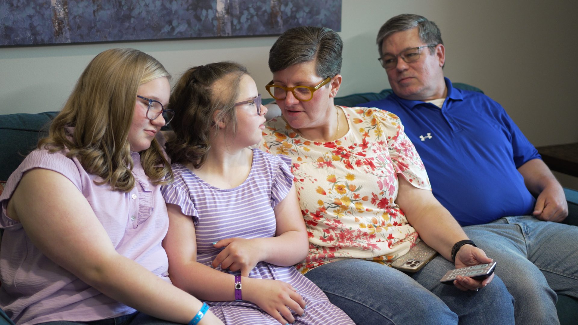 A family together on the sofa during their interview