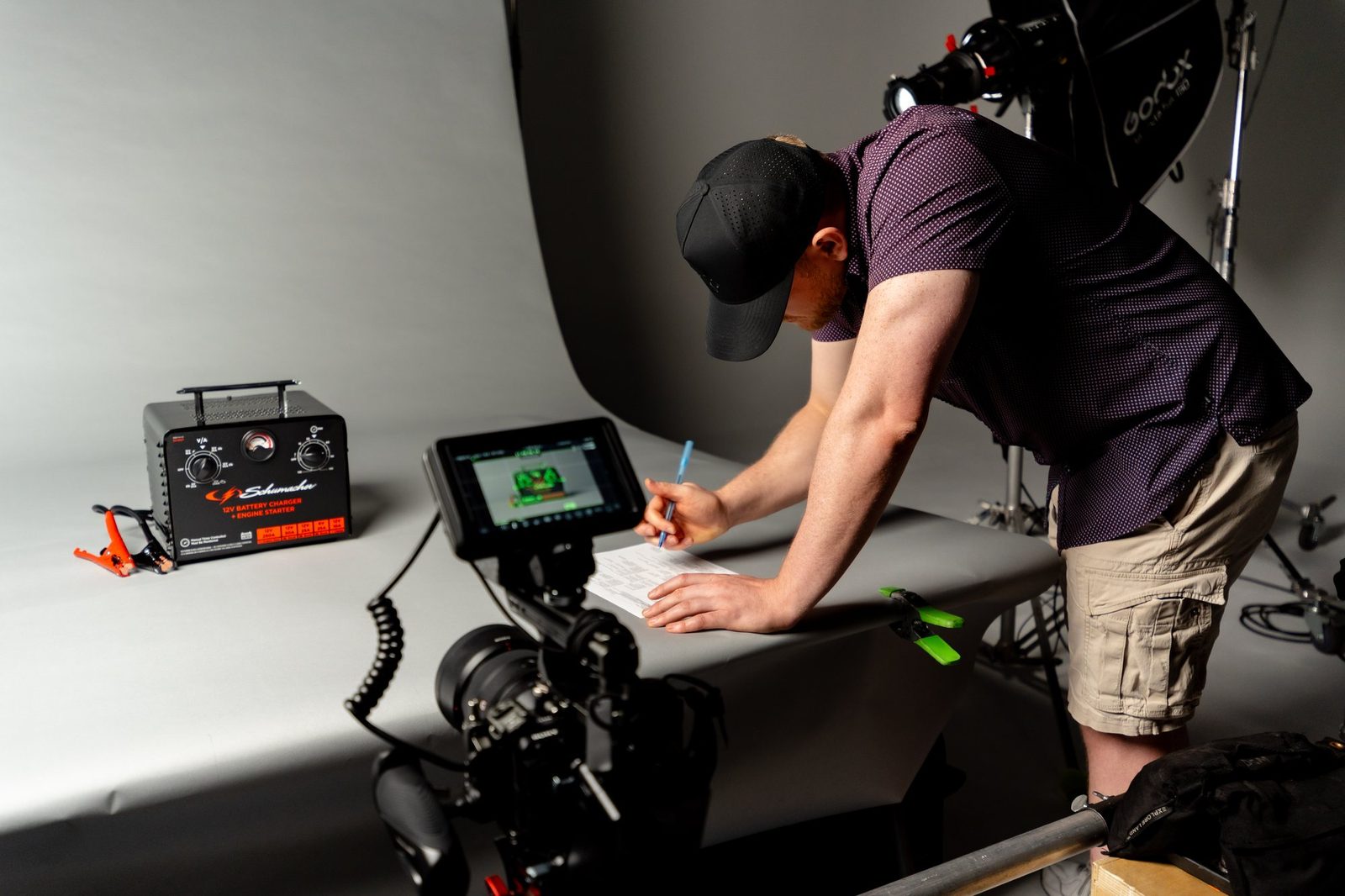 Checking framing on the camera monitor during the Schumacher product shoot