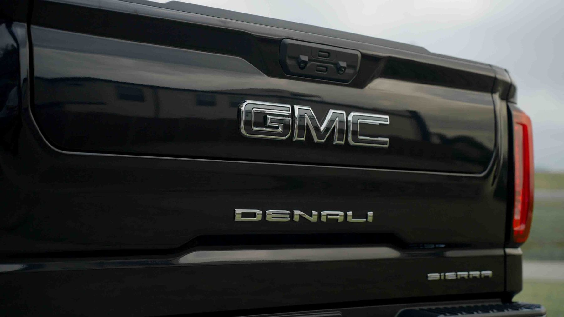 GMC Denali tailgate on a black Sierra