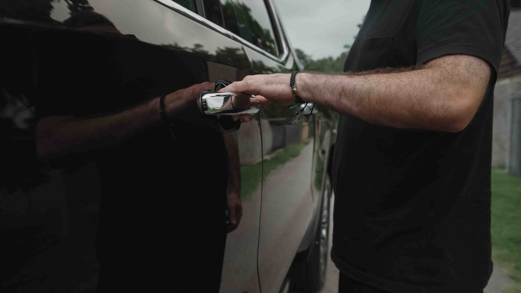 Hand on the Sierra Denali door handle