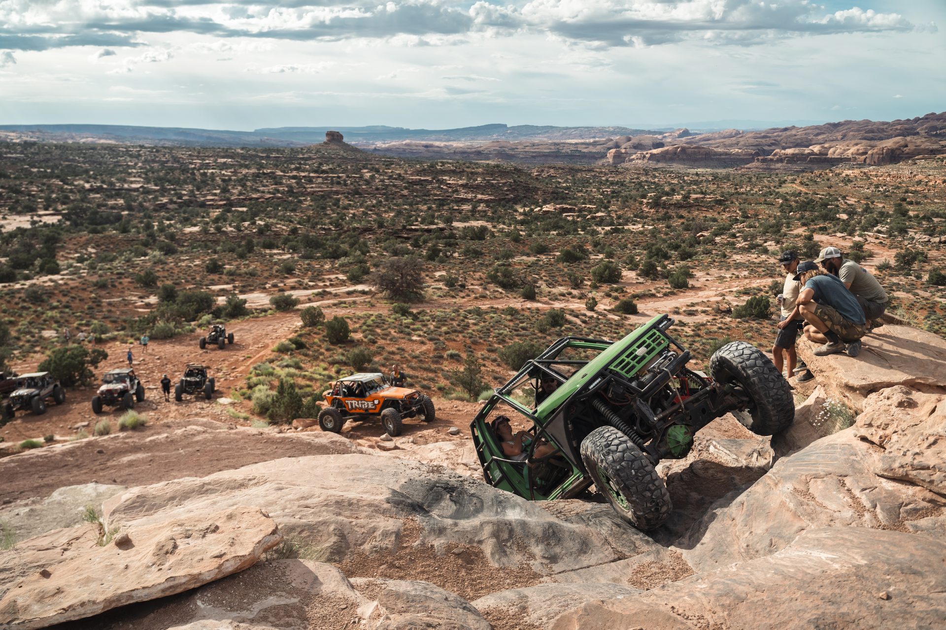 Rigs and spotters working a rocky climb