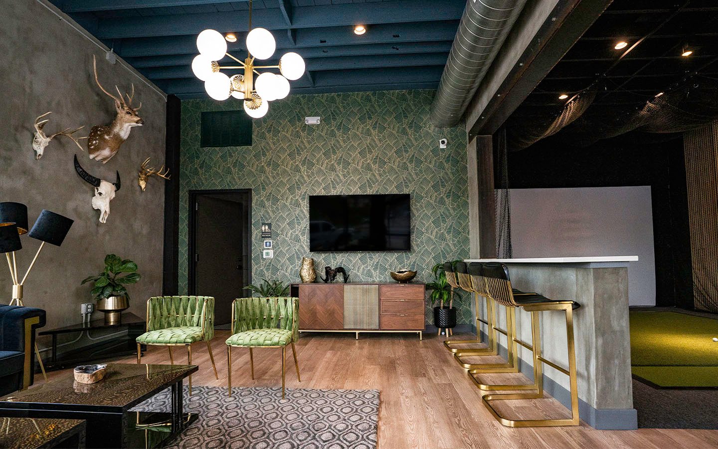 Open-plan Valley Quest office with lounge, bar and golf simulator