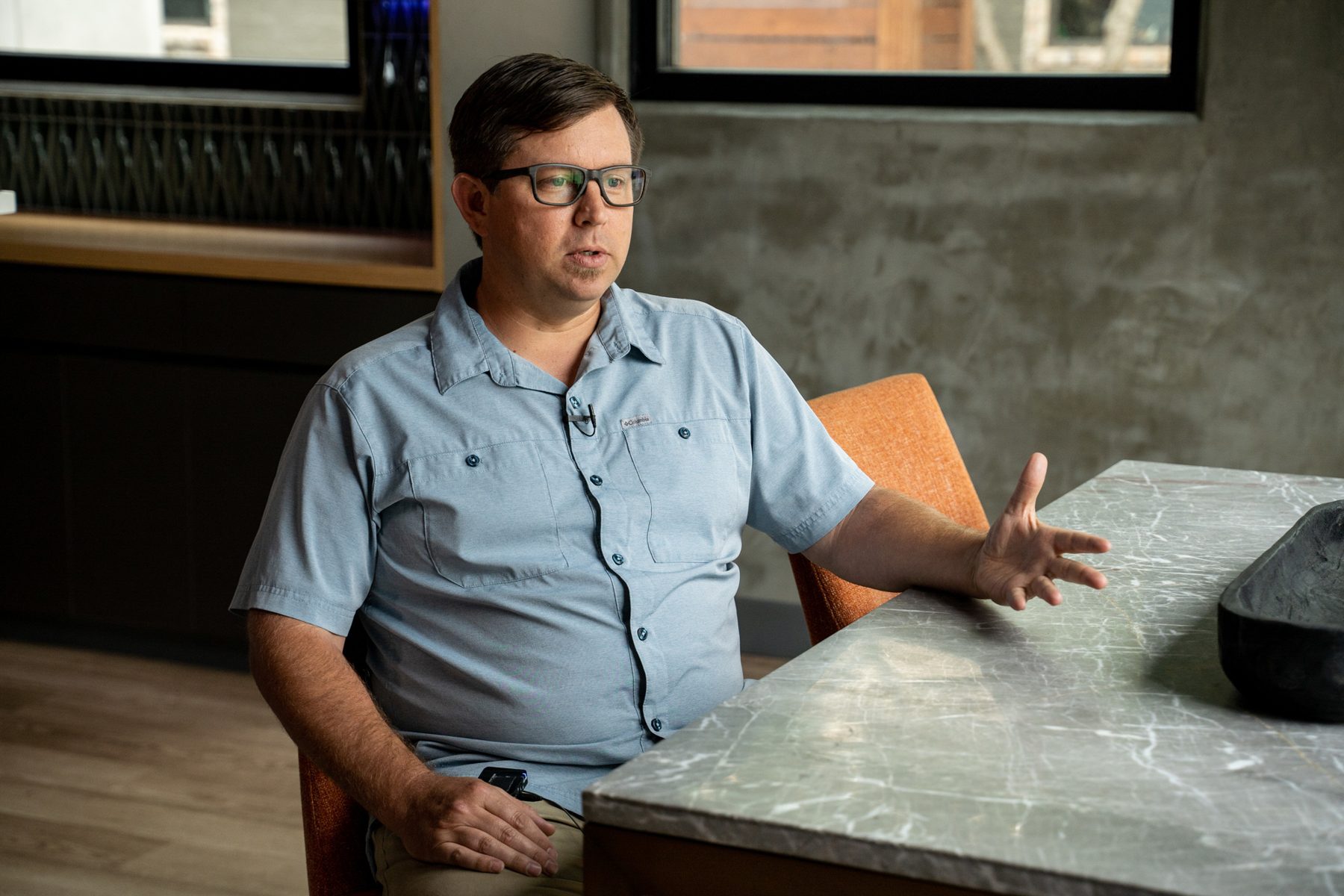 Valley Quest principal talking through a project in an interview